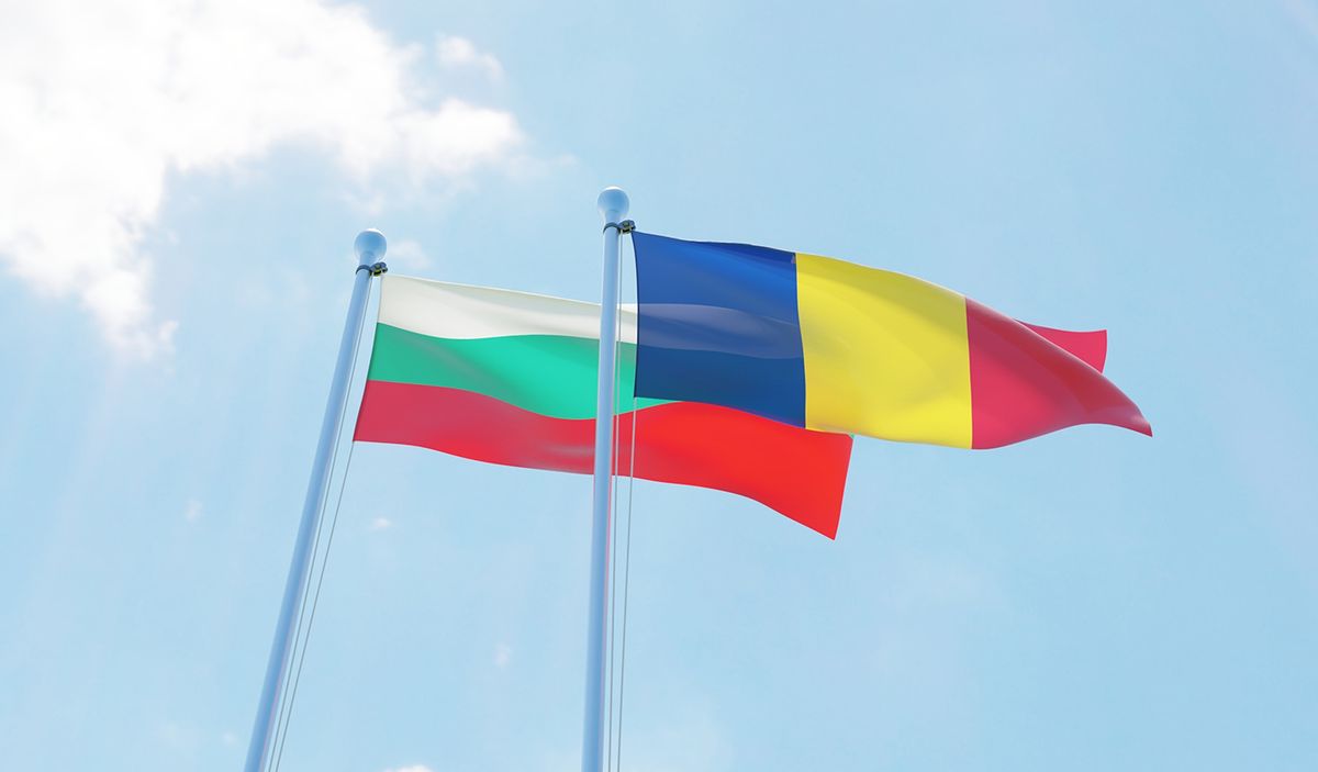 Romania,And,Bulgaria,,Two,Flags,Waving,Against,Blue,Sky.,3d