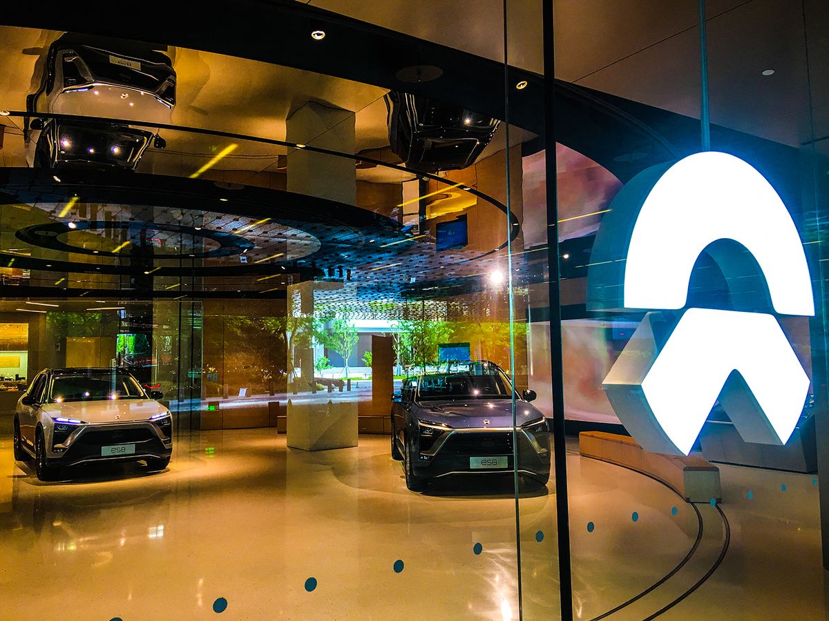 China's NEV manufacturer to deliver second model in June
--FILE--View of a dealership store of NIO in Shanghai, China, 27 April 2019.NIO Inc., a pioneer in China's premium electric vehicle market, announced Tuesday that the company has finished mass production of its ES6, the second model of the young company, and will start delivery in June. (Photo by Gao yuwen / Imaginechina / Imaginechina via AFP)