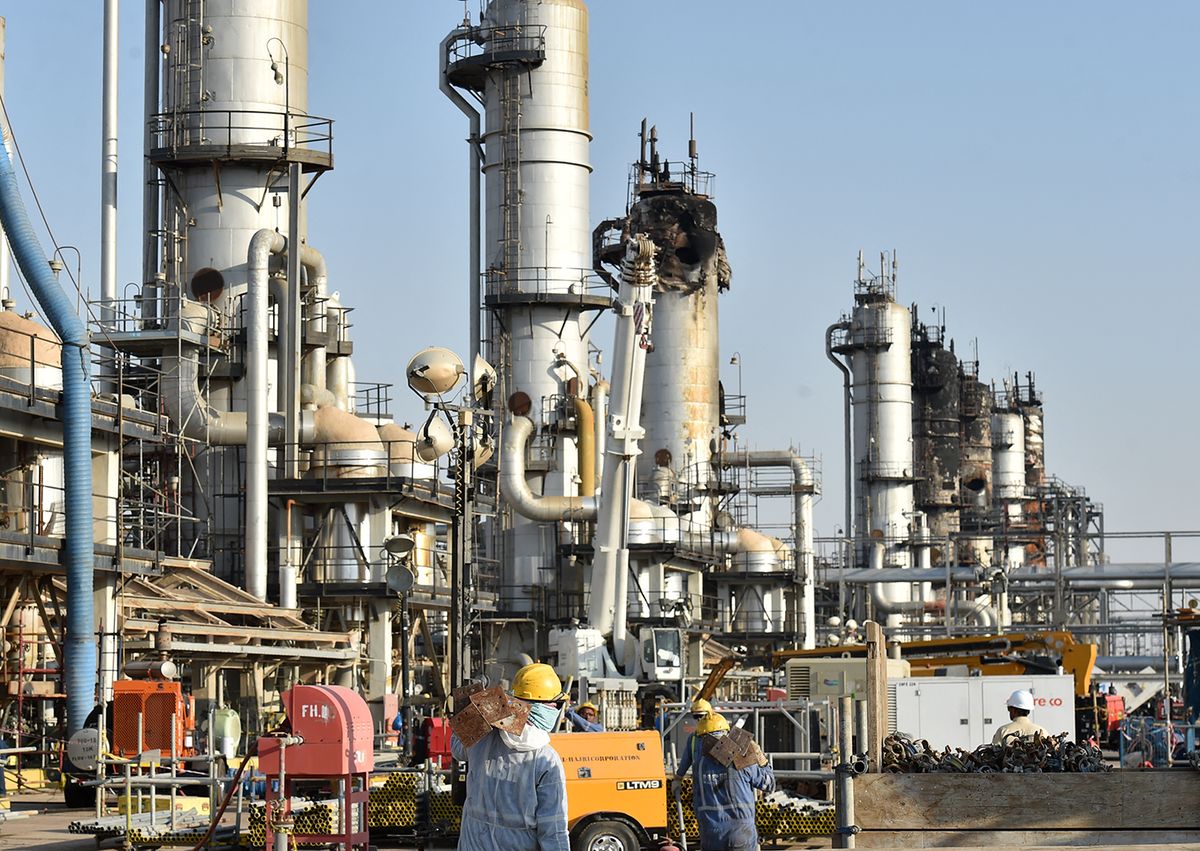 Employees of Aramco oil company work in Saudi Arabia's Abqaiq oil processing plant on September 20, 2019. Saudi Arabia said on September 17 its oil output will return to normal by the end of September, seeking to soothe rattled energy markets after attacks on two instillations that slashed its production by half. The strikes on Abqaiq –- the world's largest oil processing facility –- and the Khurais oil field in eastern Saudi Arabia roiled energy markets and revived fears of a conflict in the tinderbox Gulf region. (Photo by Fayez Nureldine / AFP)