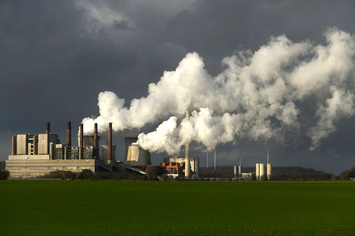 The picture shows a coal power plant of German energy giant RWE in Neurath, western Germany, on January 29, 2020. Bowing to public pressure on climate change, Germany on January 16, 2020 promised to speed up its exit from coal power generation and to pay operators compensation in a strategy instantly rejected by environmental campaigners. (Photo by INA FASSBENDER / AFP)