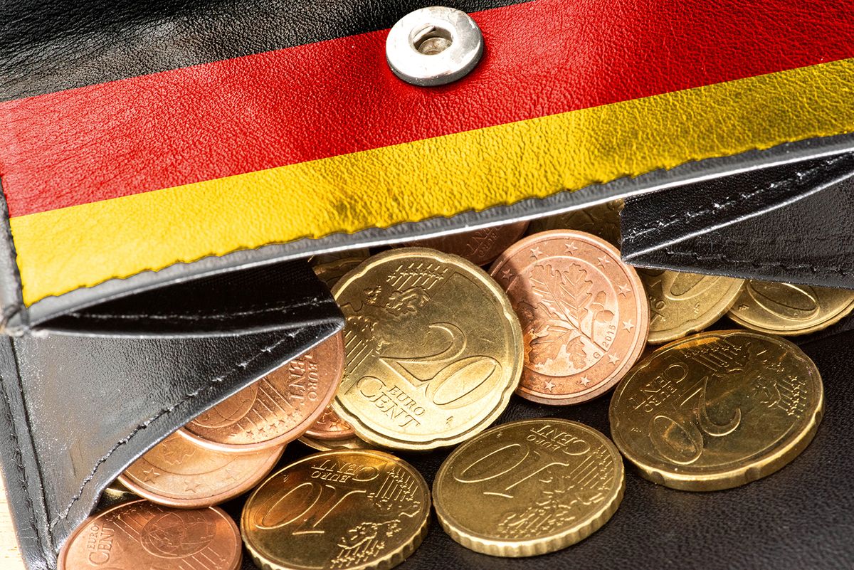 A,Purse,With,A,German,Flag,And,Many,Euro,Coins
A purse with a German flag and many euro coins