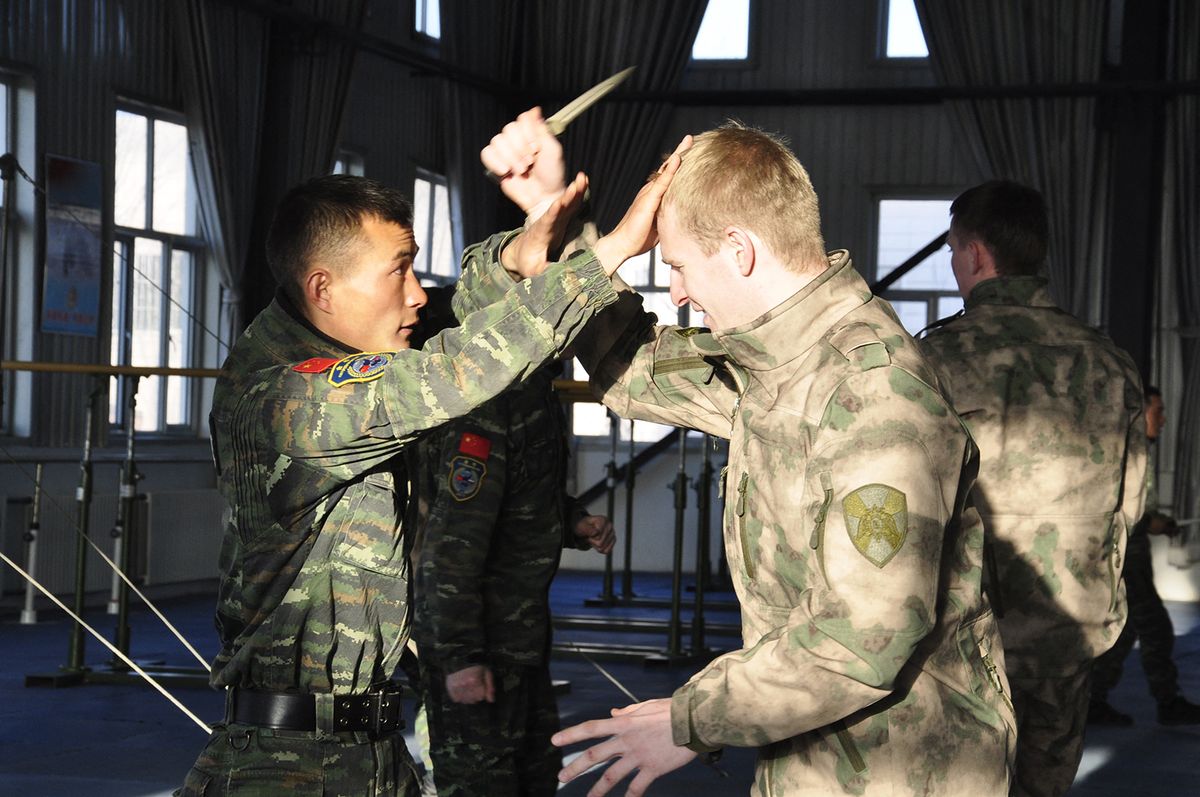 CHINA-YINCHUAN-RUSSIA-JOINT DRILL (CN)
(171205) -- YINCHUAN, Dec. 5, 2017 (Xinhua) -- Chinese and Russian soldiers take part in a joint anti-terror drill in Yinchuan, capital of northwest China's Ningxia Hui Autonomous Region, Dec. 4, 2017. (Xinhua/Yang Yawen) (ry) (Photo by Yang Yawen / XINHUA / Xinhua via AFP) (171205) -- YINCHUAN, Dec. 5, 2017 (Xinhua) -- Chinese and Russian soldiers take part in a joint anti-terror drill in Yinchuan, capital of northwest China's Ningxia Hui Autonomous Region, Dec. 4, 2017. (Xinhua/Yang Yawen) (ry) (Photo by Yang Yawen / XINHUA / Xinhua via AFP)