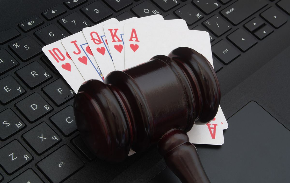Wooden,Judge,Gavel,And,Playing,Cards,On,Computer,Keyboard