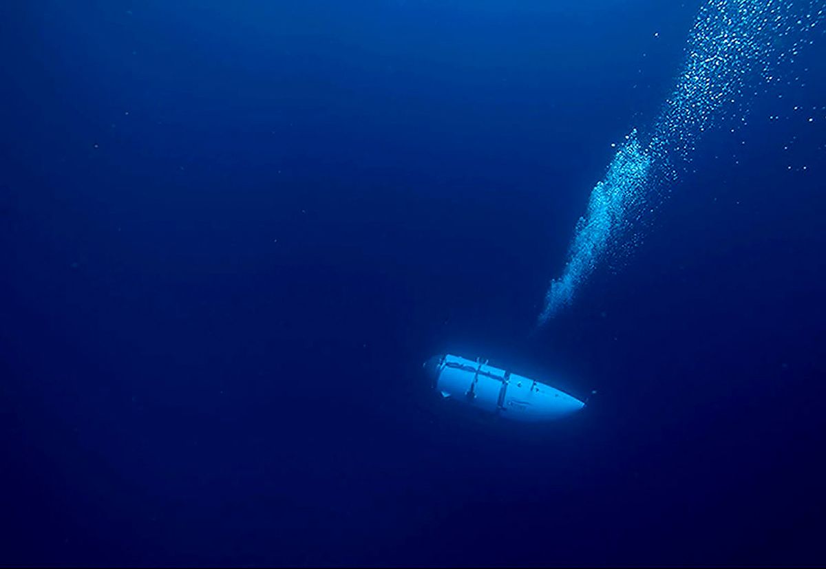 This undated image courtesy of OceanGate Expeditions, shows their Titan submersible during a descent. Rescue teams expanded their search underwater on June 20, 2023, as they raced against time to find a Titan deep-diving tourist submersible that went missing near the wreck of the Titanic with five people on board and limited oxygen. All communication was lost with the 21-foot (6.5-meter) Titan craft during a descent June 18 to the Titanic, which sits at a depth of crushing pressure more than two miles (nearly four kilometers) below the surface of the North Atlantic. (Photo by Handout / OceanGate Expeditions / AFP) / RESTRICTED TO EDITORIAL USE - MANDATORY CREDIT "AFP PHOTO / OceanGate Expeditions" - NO MARKETING NO ADVERTISING CAMPAIGNS - DISTRIBUTED AS A SERVICE TO CLIENTS