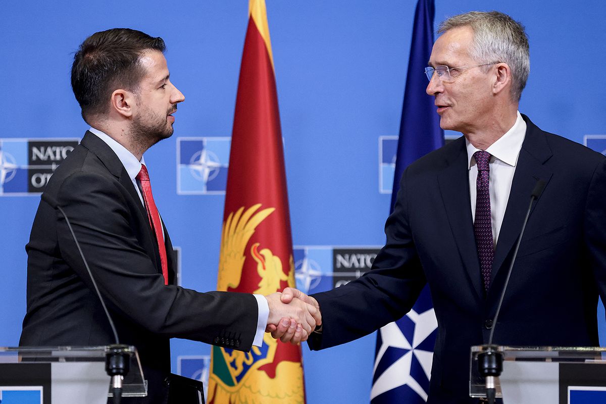 NATO Secretary General Jens Stoltenberg (R) and President of Montenegro, Jakov Milatovic shake hands at the end of a joint statement at the NATO headquarters in Brussels on June 22, 2023. (Photo by Kenzo TRIBOUILLARD / AFP)