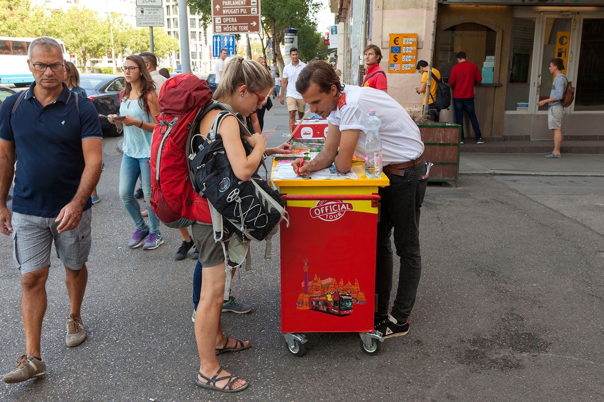 Budapest,,Hungary,,September,13,,2017:,Backpackers,At,A,City,Guide
Budapest, Hungary, September 13, 2017: Backpackers at a city guide tour stand in central Budapest, checking out optional tours.