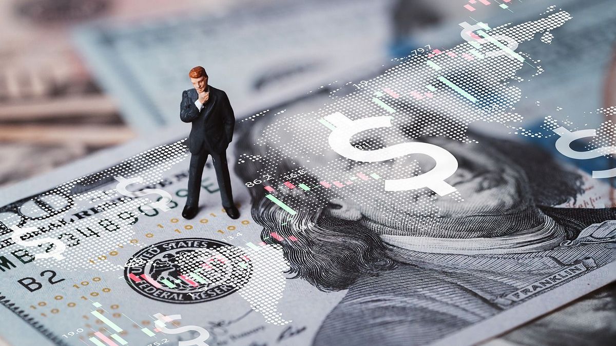 Businessman,Miniature,Figure,Standing,On,Usd,Banknote,With,Stock,Market
Businessman miniature figure standing on USD banknote with stock market chart graph for currency exchange of global trade forex and Fed increase interest rate to stop inflation concept.