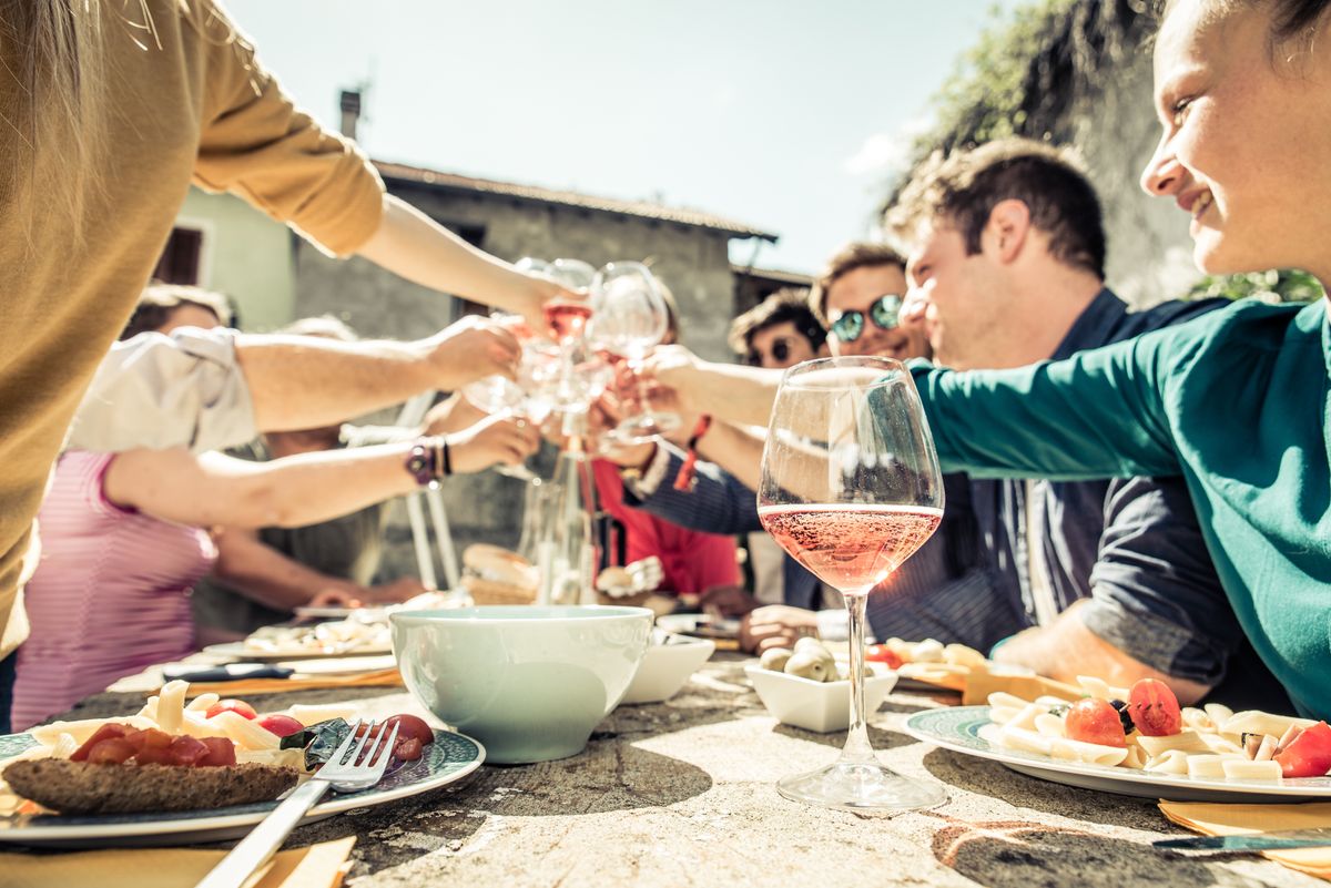 Group,Of,Friends,Toasting,Wine,Glasses,And,Having,Fun,Outdoors