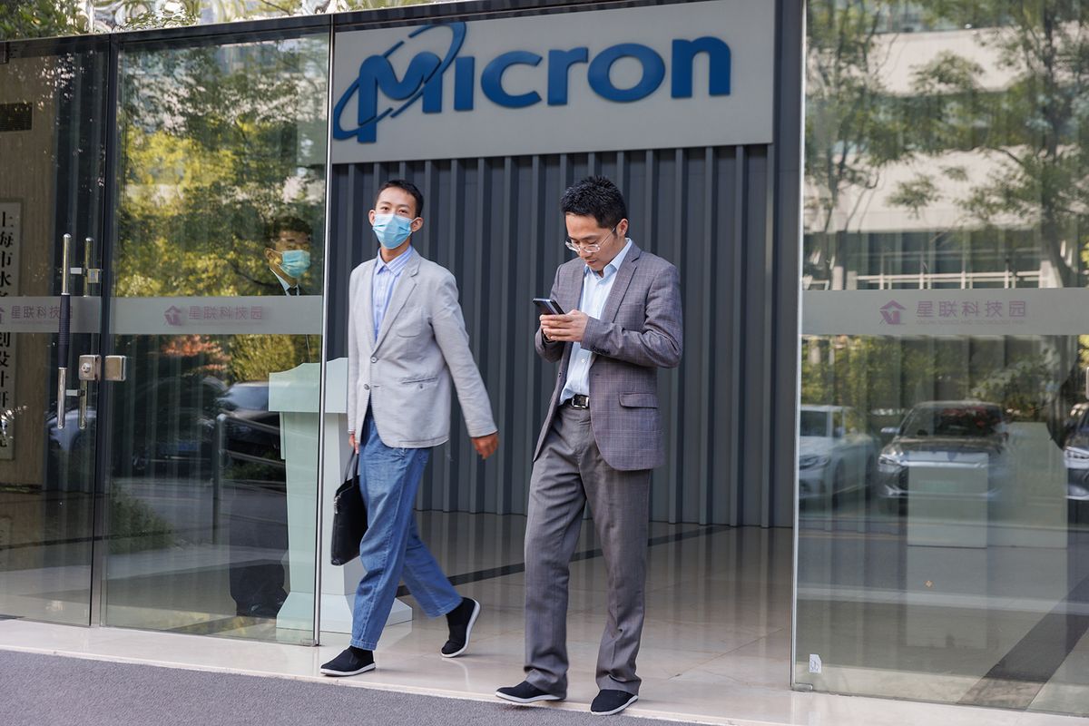 China bans major US chip maker Micron from key infrastructure projects
epa10647331 People exit the Micron headquarters building in Shanghai, China, 23 May 2023. China banned major US chip maker Micron from key infrastructure projects on claims of national security risk after the Cyberspace Administration of China (CAC) announced on 21 May that Micron had failed to pass a cybersecurity review.  EPA/ALEX PLAVEVSKI