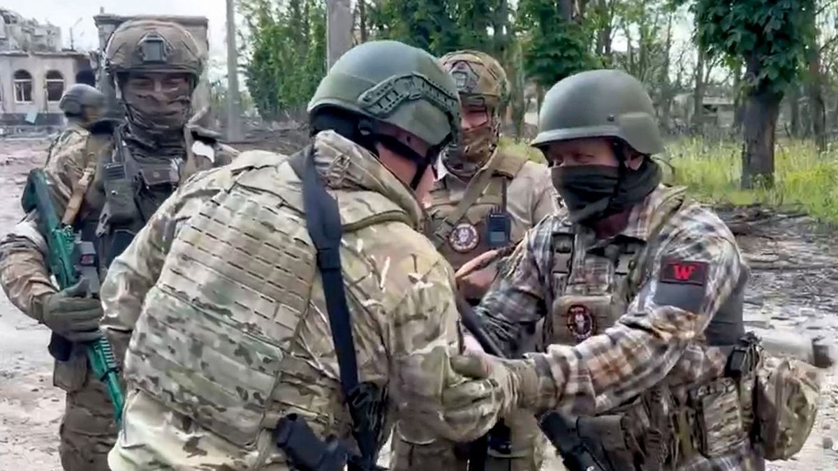 WAGNER
This video grab taken from a handout footage posted on May 20, 2023 on the Telegram account of the press service of Concord -- a company linked to the chief of Russian mercenary group Wagner, Yevgeny Prigozhin -- shows Yevgeny Prigozhin (2-L) shaking hands with his soldiers in Bakhmut, amid the Russian invasion of Ukraine. Russia's private army Wagner claimed on May 20, 2023, the total control of the east Ukrainian city of Bakhmut, the epicentre of fighting, as Kyiv said the battle was continuing but admitted the situation was "critical". Bakhmut, a salt mining town that once had a population of 70,000 people, has been the scene of the longest and bloodiest battle in Moscow's more than year-long Ukraine offensive. The fall to Russia of Bakhmut, where both Moscow and Kyiv are believed to have suffered huge losses, would have high symbolic value. (Photo by Handout / various sources / AFP) / RESTRICTED TO EDITORIAL USE - MANDATORY CREDIT "AFP PHOTO /  Telegram channel of Concord group" - NO MARKETING - NO ADVERTISING CAMPAIGNS - DISTRIBUTED AS A SERVICE TO CLIENTS