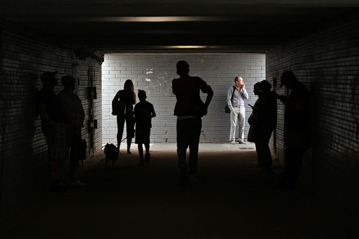People take shelter in an underground crossing during the Russian attack on the Ukrainian capital of Kyiv, on June 1, 2023. The attack began around 3:00 am local time on June 1, 2023, when cruise and ballistic missiles were fired on the city, killing three people and injuring 12 others, officials said. "In the Desnyanskyi district: three people died, including one child (born in 2012) and 10 people were injured, including one child," the Kyiv City Military Administration wrote on Telegram.