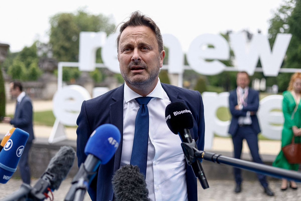 Luxembourg's Prime Minister Xavier Bettel talks to the media as he arrives for the Renew Europe Leaders meeting ahead of the European Council Summit, in Brussels, on June 29, 2023. (Photo by Kenzo TRIBOUILLARD / AFP) BELGIUM-EU-POLITICS-SUMMIT-RENEW