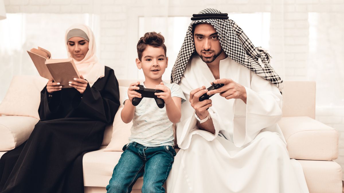 Happy,Arabian,Family,Playing,On,Console,At,Home.,Family,Sitting