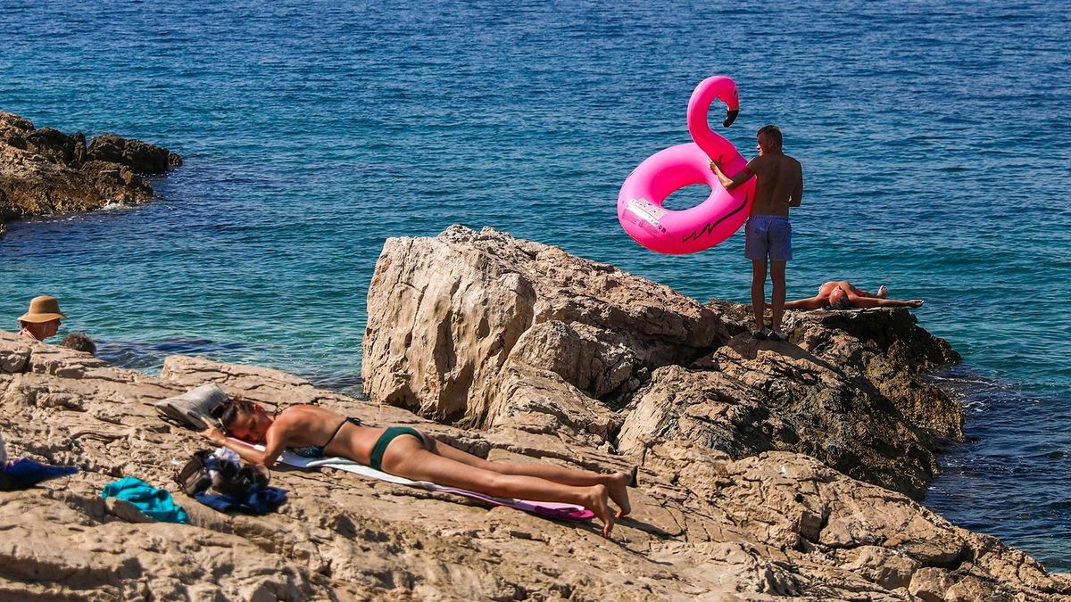 Daily Life In Primosten, Croatia
People are relaxing on a rocky beach in Primosten, Croatia on September 14, 2021. (Photo by Beata Zawrzel/NurPhoto) (Photo by Beata Zawrzel / NurPhoto / NurPhoto via AFP)
