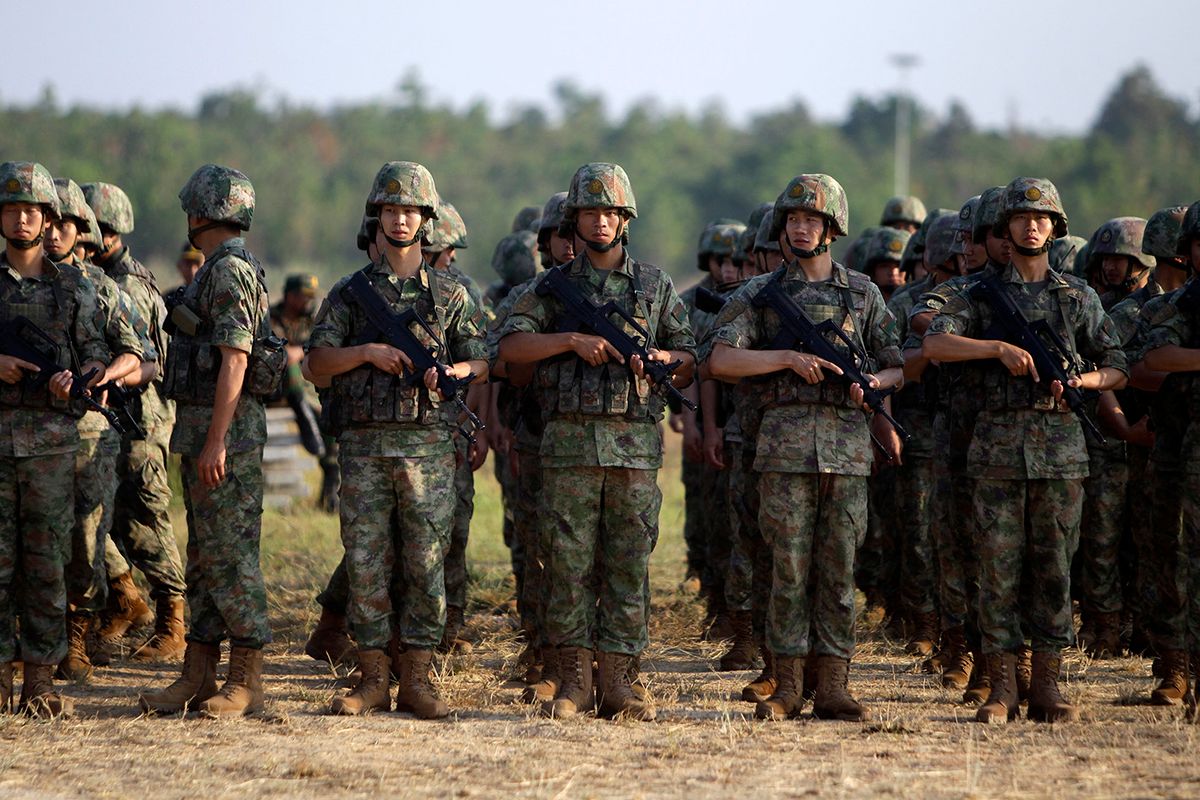 CAMBODIA-KAMPONG CHHNANG-CHINA-JOINT MILITARY EXERCISE-GOLDEN DRAGON 2023(230323) -- KAMPONG CHHNANG, March 23, 2023 (Xinhua) -- Chinese soldiers attend the Cambodia-China "Golden Dragon 2023" joint military exercise at the Royal Gendarmerie Training Center in Cambodia, March 23, 2023. The joint military exercise kicked off here on Thursday, focusing on security operations for major events and humanitarian rescue.   General Hun Manet, deputy commander-in-chief of the Royal Cambodian Armed Forces and commander of the Royal Cambodian Army of Cambodia, and Major General Chen Mintian, deputy chief of staff of Southern Theater Command of the Chinese People's Liberation Army, attended the opening ceremony.   The event was also participated by military attaches from various countries to Cambodia, and observers from a number of Southeast Asian countries. (Photo by Phearum/Xinhua) (Photo by Wu Changwei / XINHUA / Xinhua via AFP)
