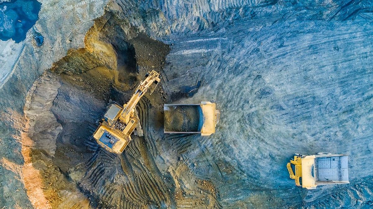 Quarry,Mining,,Work,Of,The,Excavator,And,Dump,Trucks,,PhotoQuarry mining, work of the excavator and dump trucks, photo from the air