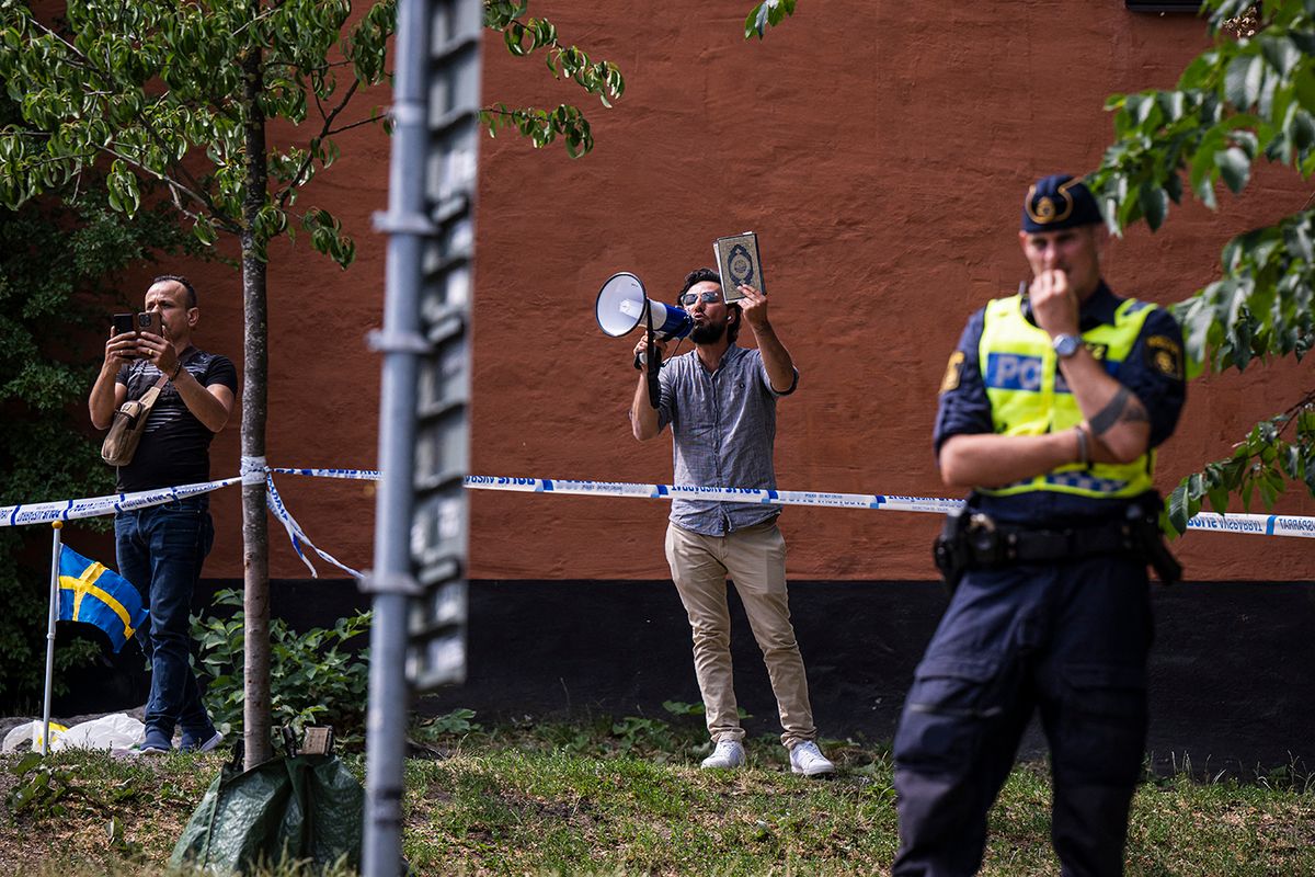 SWEDEN-KORAN-PROTESTSalwan Momika protests outside a mosque in Stockholm on June 28, 2023, during the Eid al-Adha holiday. Momika, 37, who fled from Iraq to Sweden several years ago, was granted permission by the Swedish police to burn the Muslim holy book during the demonstration. (Photo by Jonathan NACKSTRAND / AFP)