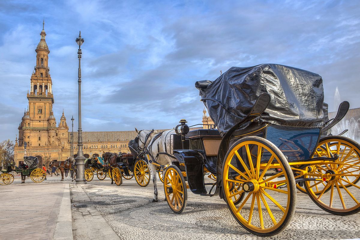 Parked,Horse,Drawn,Carriages,At,Plaza,De,Espana,In,Seville,Parked Horse drawn carriages at Plaza de Espana in Seville, Andalusia, Spain. Spain Square