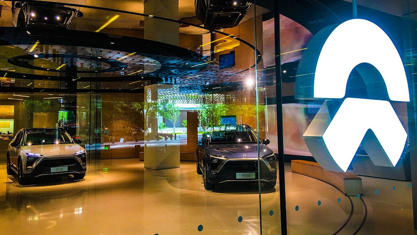 China's NEV manufacturer to deliver second model in June
--FILE--View of a dealership store of NIO in Shanghai, China, 27 April 2019.NIO Inc., a pioneer in China's premium electric vehicle market, announced Tuesday that the company has finished mass production of its ES6, the second model of the young company, and will start delivery in June. (Photo by Gao yuwen / Imaginechina / Imaginechina via AFP)