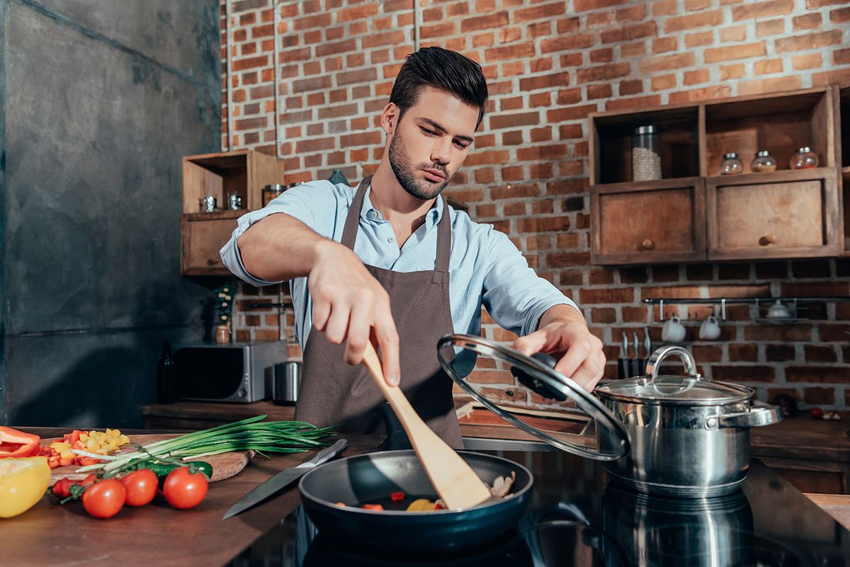 Pensive,Handsome,Man,With,Apron,Cooking