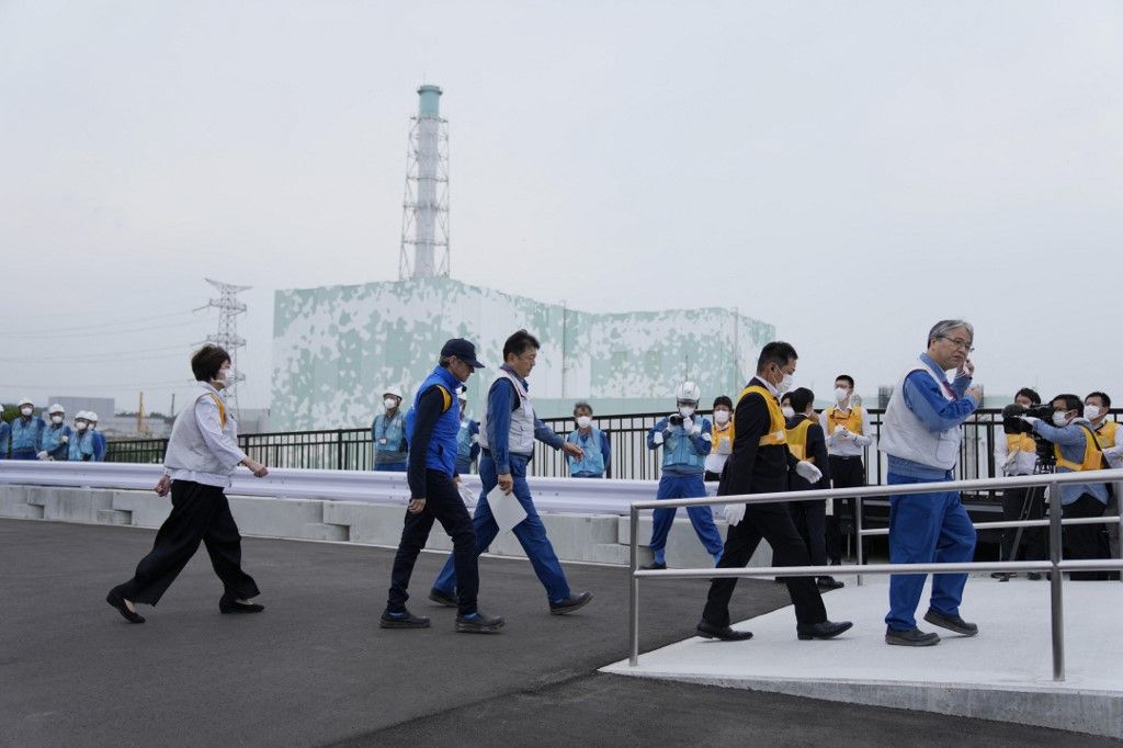 Rafael Grossi (2nd L), Director General of the International Atomic Energy Agency (IAEA), arrives to inspect the damaged Fukushima nuclear power plant as Tomoaki Kobayakawa (3rd L), President of Tokyo Electric Power Co., escorts him in Futaba on July 5, 2023. (Photo by Hiro Komae / POOL / AFP)