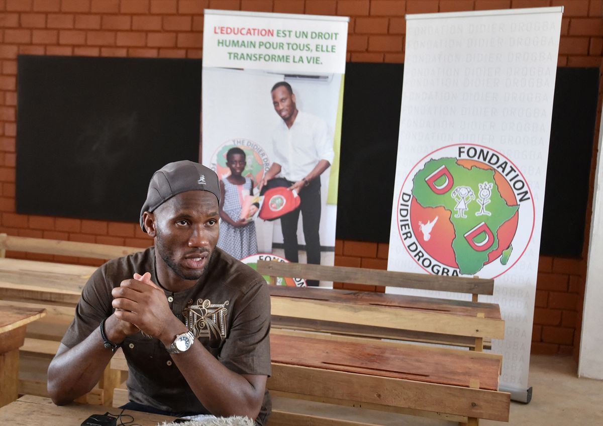Ivory Coast's football star Didier Drogba answers journalists' questions during the inauguration of the Didier Drogba Primary School on January 17, 2018 in Pokou-Kouamekro, near Gagnoa, central-western Ivory Coast. Ivory Coast's football star Didier Drogba sponsored the construction of a primary school in Pokou-Kouamekro. (Photo by Sia KAMBOU / AFP)