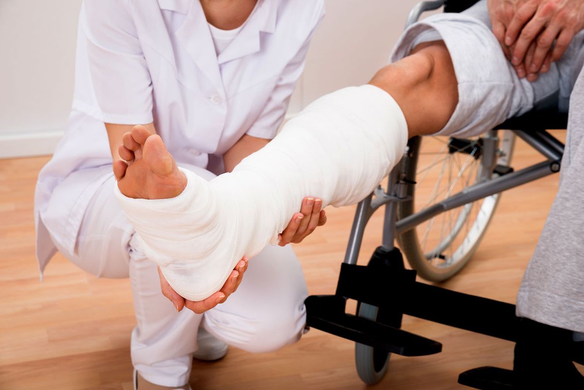 Close-up,Of,A,Female,Doctor,Holding,Disabled,Patient's,Leg
Close-up Of A Female Doctor Holding Disabled Patient's Leg