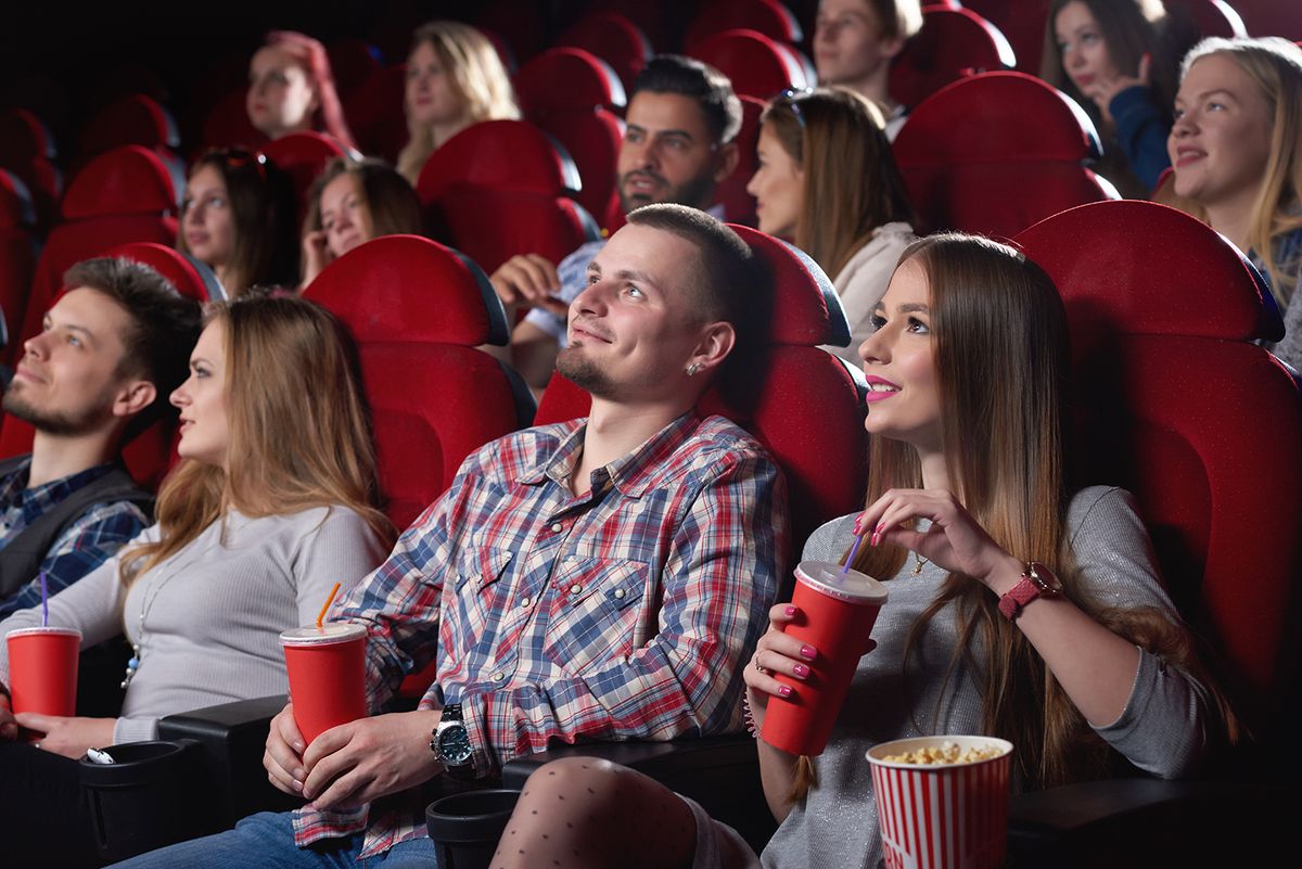 Shot,Of,Cinema,Auditorium,Full,Of,Spectators,Enjoying,Watching,A
Shot of cinema auditorium full of spectators enjoying watching a movie people lifestyle leisure entertainment happiness positivity emotions concept.