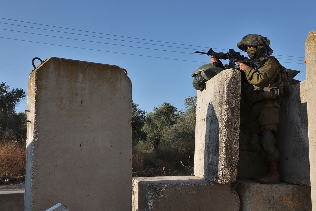 PALESTINIAN-ISRAEL-CONFLICT
An Israeli soldier mans the Reihan checkpoint near the Israeli settlement of the same name, near Jenin in the West Bank on June 22, 2023. (Photo by GIL COHEN-MAGEN / AFP)