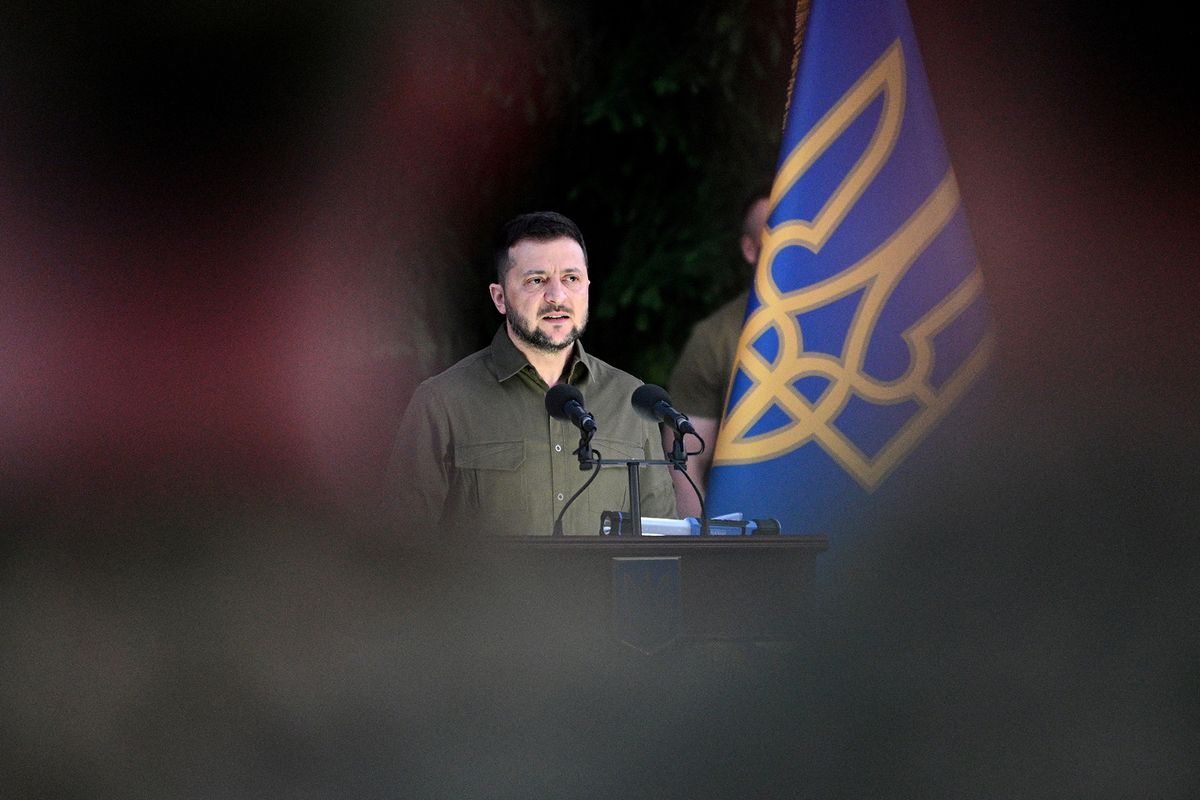 Ukrainian President Volodymyr Zelensky speaks to attendees during an event for the return of commanders of Ukrainian forces who held Mariupol's resistance in the city's Azovstal steel plant, in the western Ukrainian city of Lviv on July 8, 2023. Ukrainian commanders Denys Prokopenko, Svyatoslav Palamar, Serhyi Volynsky, Denys Shleha and Oleh Khomenko returned to Ukraine from Istanbul by plane with the Ukrainian president, who was on visit to the Turkish city. The action was slammed by the Kremlin saying both Ukraine and Turkey had violated terms of an agreement for the commanders to remain in Turkey until the end of the conflict. (Photo by YURIY DYACHYSHYN / AFP)