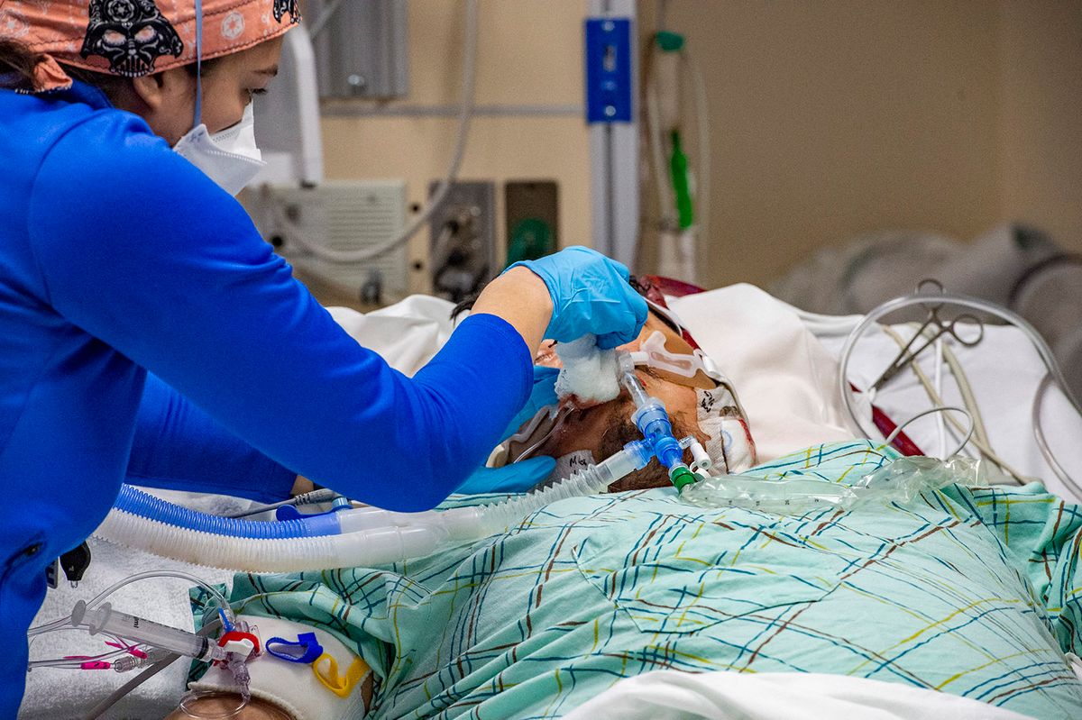 Day in the life of a doctor working on a Covid ICU ward
A medical worker treats an intubated unvaccinated 40 year old patient who is suffering from the effects of Covid-19 in the ICU at Hartford Hospital in Hartford, Connecticut on January 18, 2022. (Photo by Joseph Prezioso / AFP)