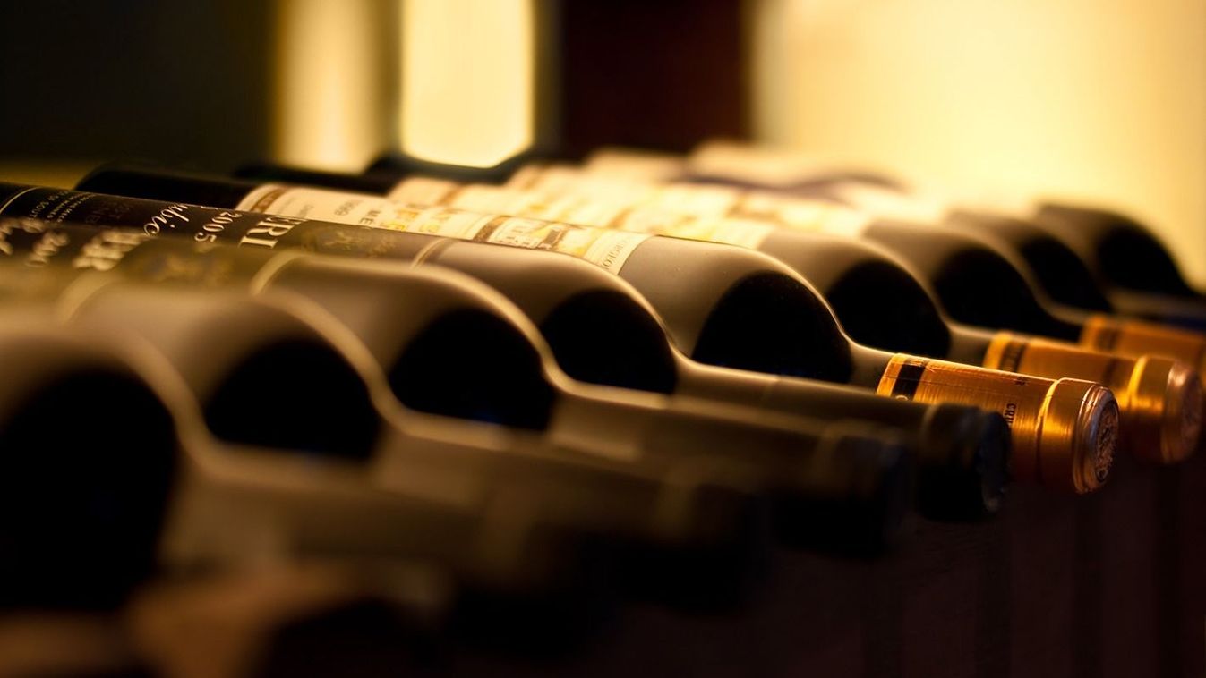 Bottles,Of,Red,Wine,On,A,Wooden,Shelf