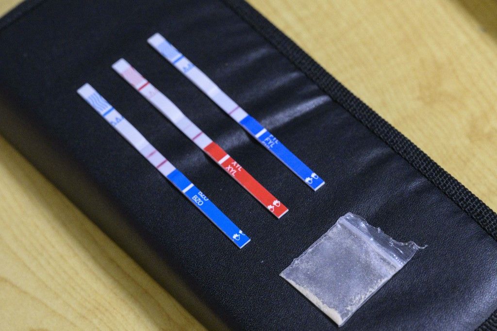 'Tranq,' the flesh-rotting drug worsening America's opioid crisisTests strips, used to detect the presence of fentanyl and xylazine in different kinds of drugs, such as cocaine, methamphetamine, and heroin, lay next to a bag of heroin at St. Ann's Corner of Harm Reduction in New York City on May 25, 2023. The tranquillizer, approved for veterinary use by the US Food and Drug Administration (FDA), has infiltrated the illegal drugs market in the US, with producers increasingly using it to augment fentanyl. Overdose deaths where tranq was detected have soared in recent years and in April the White House designated the drug an "emerging threat." (Photo by ANGELA WEISS / AFP)