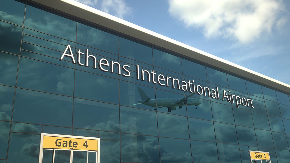 Commercial,Plane,Take,Off,Reflecting,In,The,Windows,With,Athens