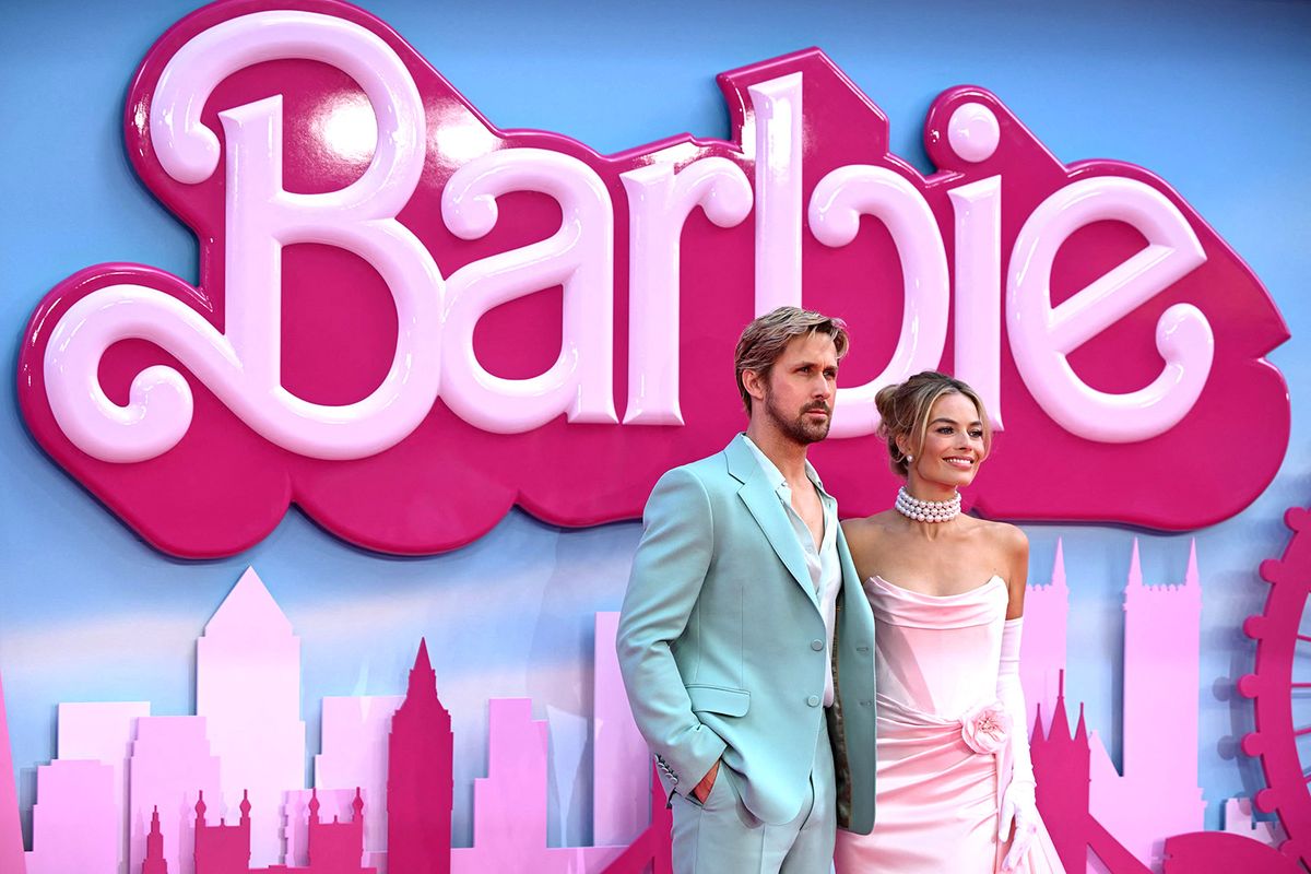 Canadian actor Ryan Gosling and Australian actress Margot Robbie (R) pose on the pink carpet upon arrival for the European premiere of "Barbie" in central London on July 12, 2023. (Photo by JUSTIN TALLIS / AFP)
