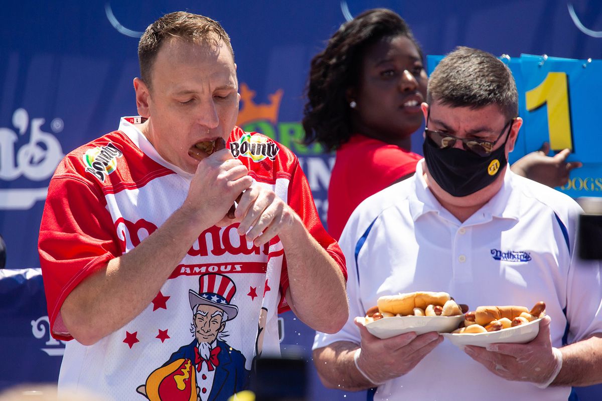 U.S.-NEW YORK-HOT DOG EATING CONTEST
(210705) -- NEW YORK, July 5, 2021 (Xinhua) -- Joey Chestnut (L) competes in a hot dog eating contest in New York, the United States, on July 4, 2021. Defending champion Joey Chestnut broke his own world record Sunday by devouring 76 hot dogs in 10 minutes at the contest. Michelle Lesco won the women's title by eating 30.75 hot dogs in 10 minutes. (Xinhua/Michael Nagle)Xinhua News Agency / eyevineContact eyevine for more information about using this image:T: +44 (0) 20 8709 8709E: info@eyevine.comhttp://www.eyevine.com
