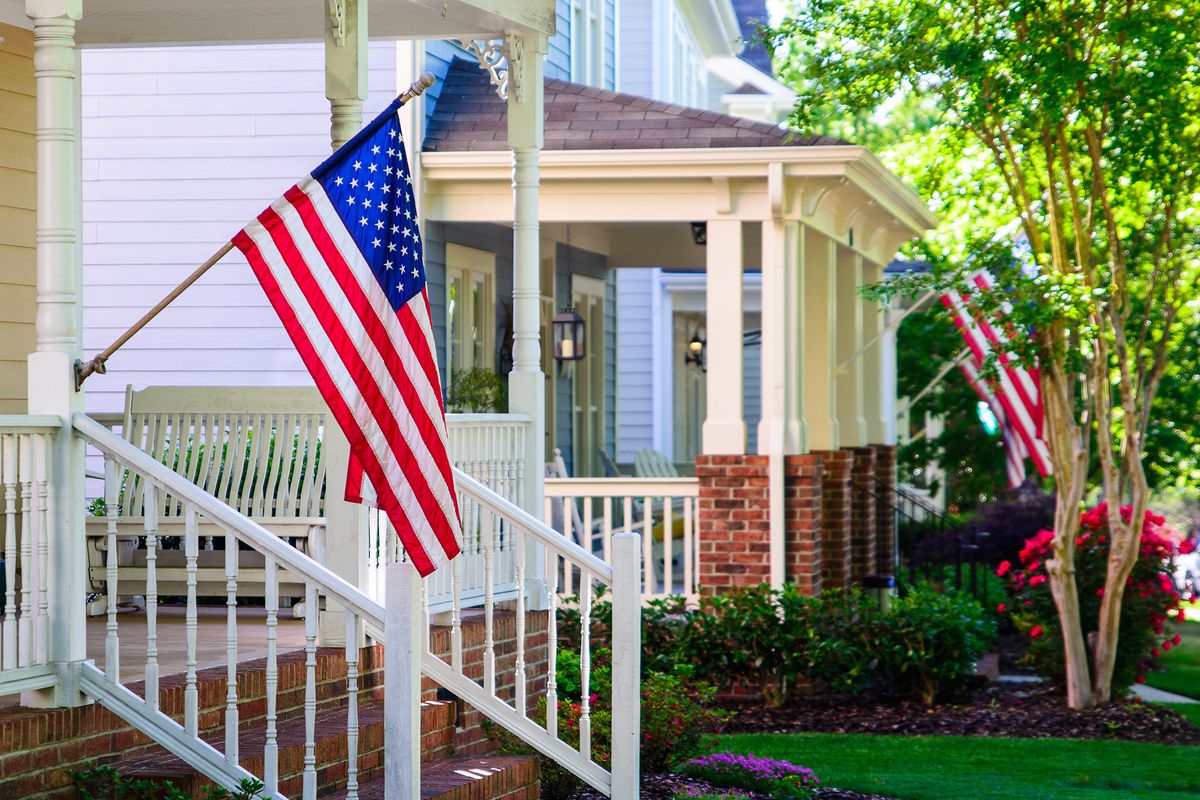 A,Line,Of,Suburban,Homes,Display,Large,American,Flags