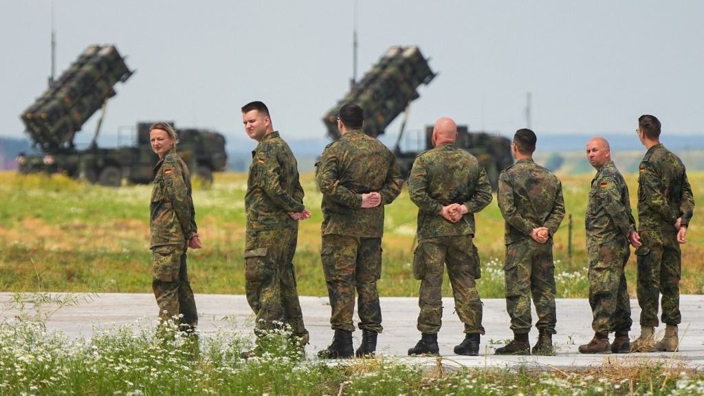 03 July 2023, Poland, Zamosc: Seven soldiers from the German Air and Missile Defense Task Force (PATRIOT) contingent stand side by side. German Defense Minister Pistorius visited the deployment site in the afternoon. Photo: Soeren Stache/dpa (Photo by SOEREN STACHE / DPA / dpa Picture-Alliance via AFP)