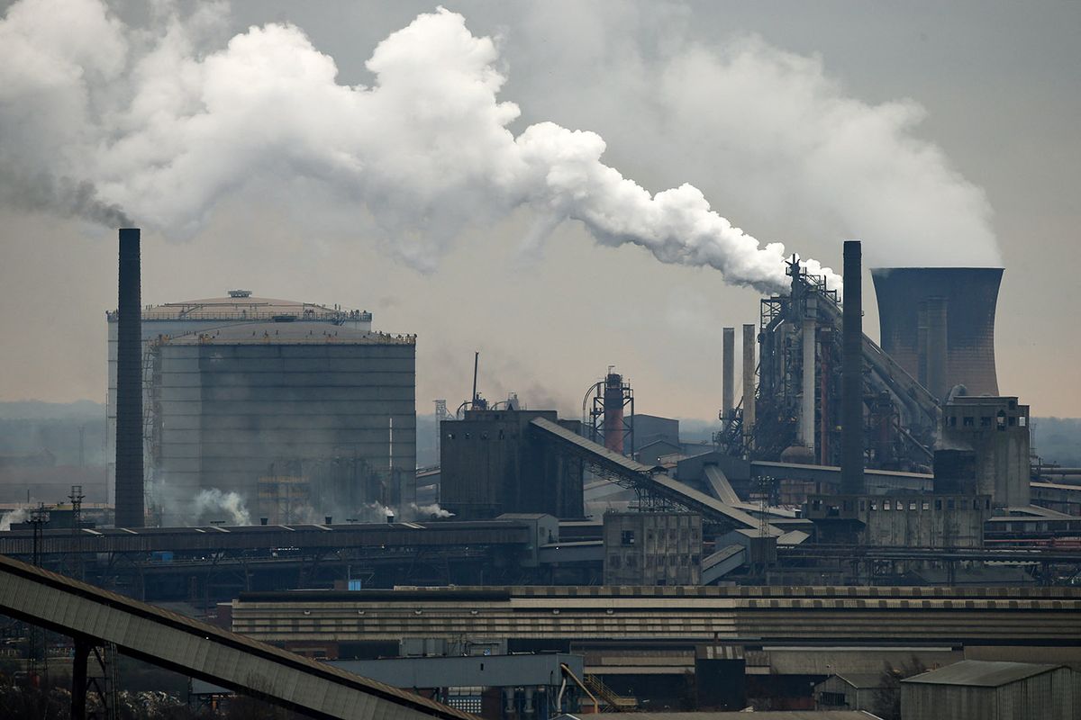 BRITAIN-POLITICS-INDUSTRY-STEEL-BRITISH STEEL-LAYOFFSVapour rises from the coke ovens (bottom left) at British Steel's Scunthorpe plant, in north Lincolnshire, north east England on February 22, 2023. British Steel plans to cut up to 260 jobs in Britain after being hit by soaring energy costs, the Chinese-owned group announced Wednesday. The company said its energy costs last year increased by Ł190 million ($230 million). "Decisive action is required because of the unprecedented rise in operating costs, surging inflation and the need to improve environmental performance," it said in a statement. (Photo by Lindsey Parnaby / AFP)