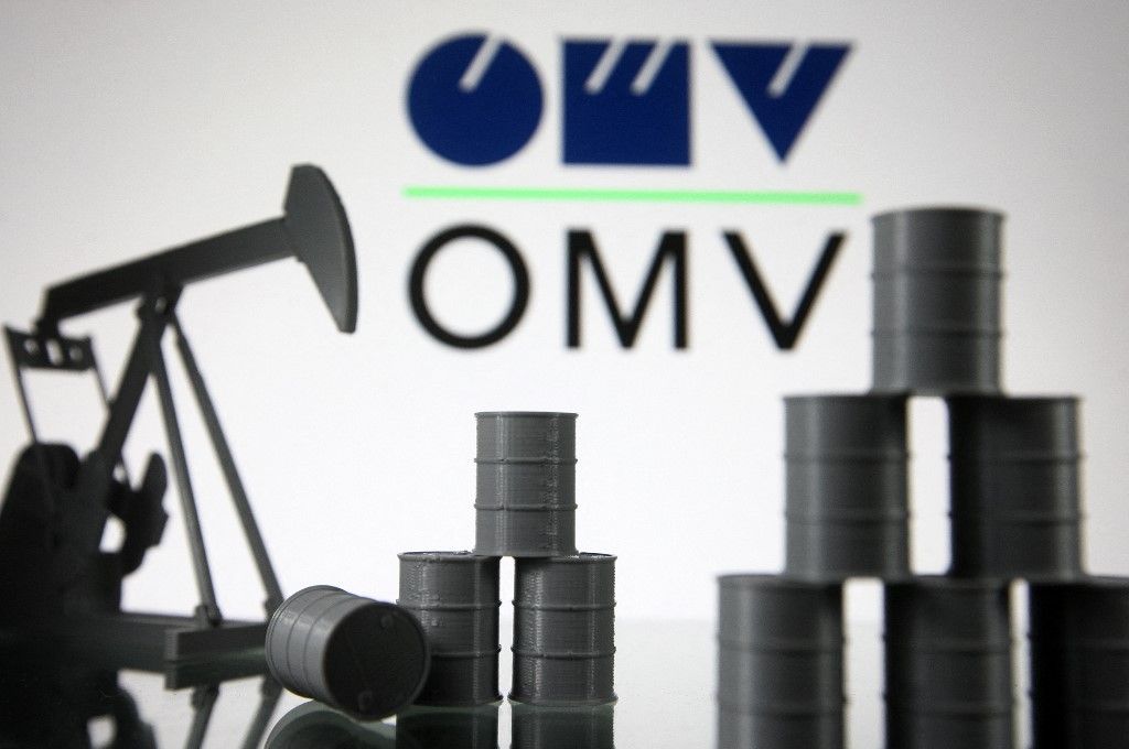 Economy Illustration
OMV logo and models of an oil derrick pump jack and oil barrels are pictured in this illustration photo taken in Kyiv on 19 August, 2021. (Photo by STR/NurPhoto) (Photo by NurPhoto / NurPhoto via AFP)