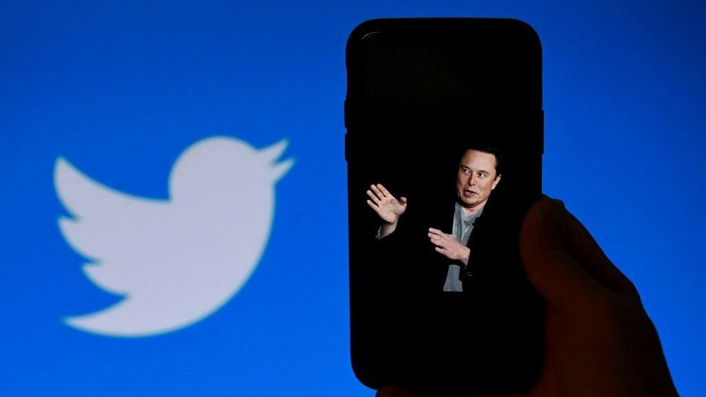 Musk says Twitter has lost half its advertising revenue(FILES) In this photo illustration, a phone screen displays a photo of Elon Musk with the Twitter logo shown in the background, on October 4, 2022, in Washington, DC. Twitter owner Elon Musk said July 15 that the social media platform he bought for $44 billion last October has lost roughly half of its advertising revenue.
"We're still negative cash flow, due to ~50% drop in advertising revenue plus heavy debt load," the billionaire said in a post, responding to a user who was giving suggestions on financing for the platform. (Photo by OLIVIER DOULIERY / AFP)