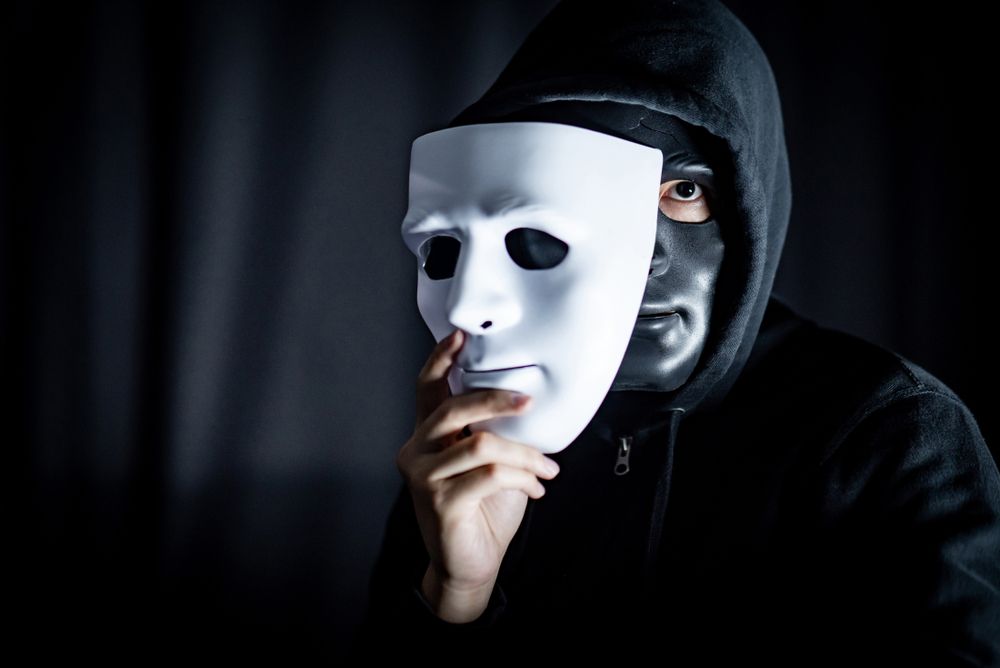 Mystery,Hoody,Man,Wearing,Black,Mask,Holding,White,Mask.,Anonymous