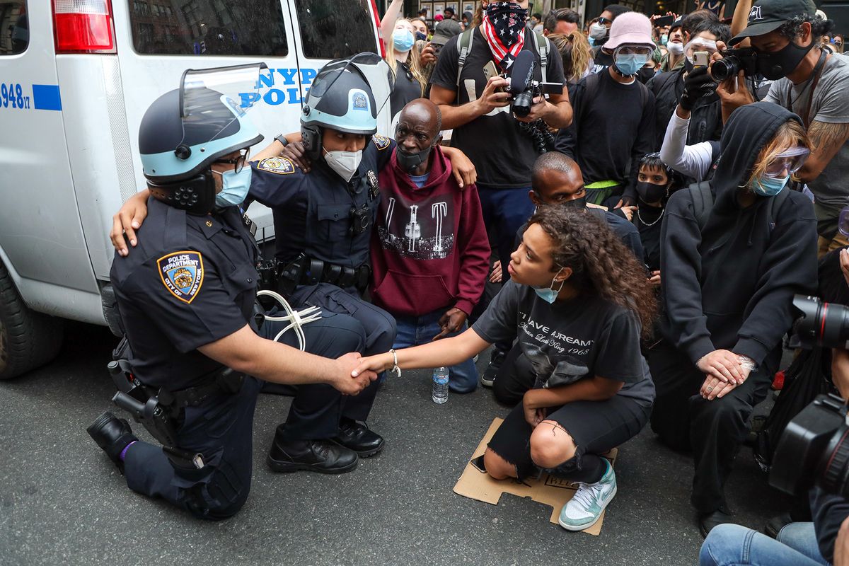 A girl after negotiating for long minutes convinced two NYPD officers to kneel along with the other protesters in support of the fight against racism and George Floyd's memory