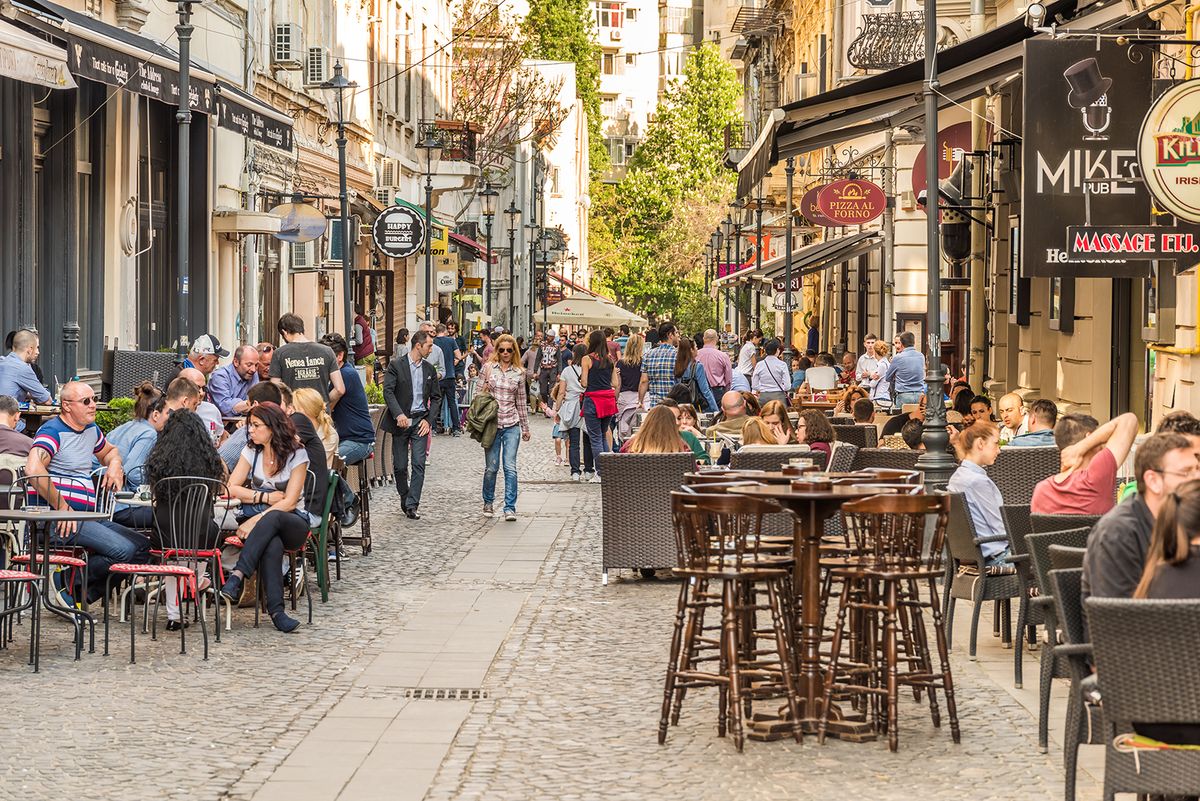 Bucharest,,Romania,-,May,18,,2015:,Tourists,Visiting,And,Having
BUCHAREST, ROMANIA - MAY 18, 2015: Tourists Visiting And Having Lunch At Outdoor Restaurant Cafe Downtown Lipscani Street, one of the most busiest streets of central Bucharest.