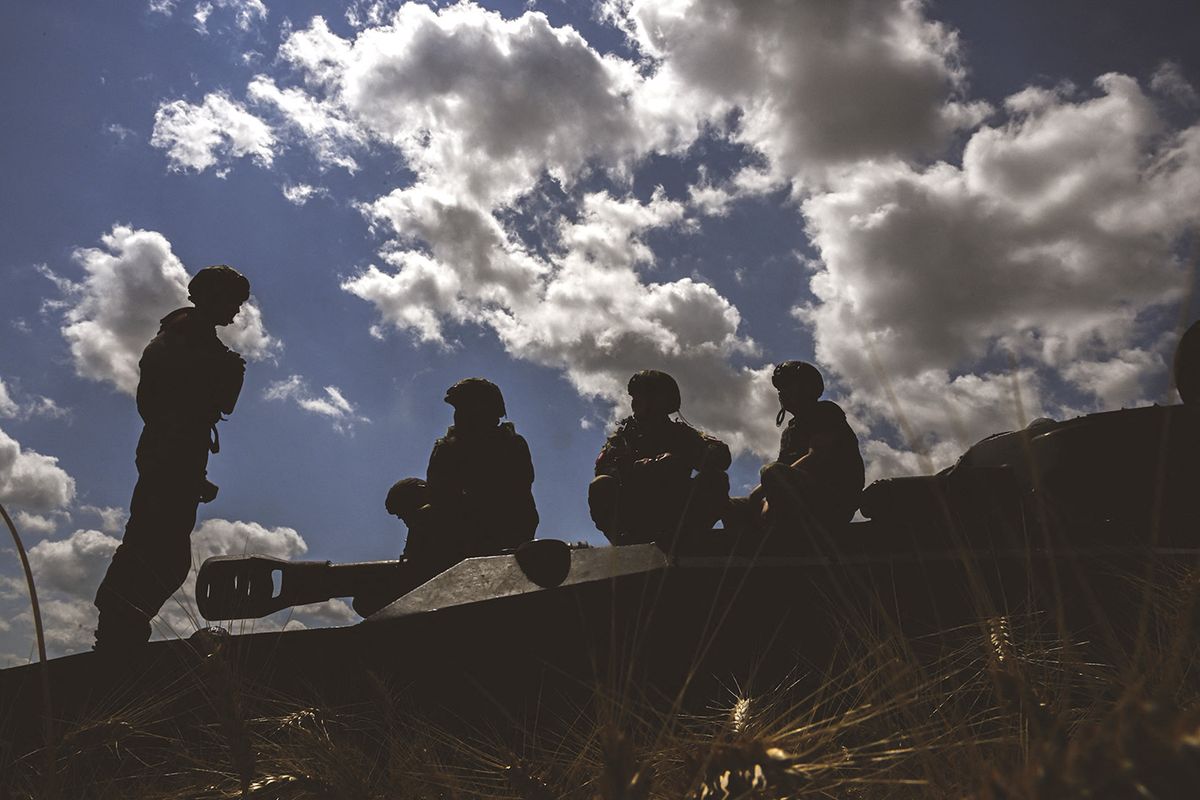 Military mobility continues in Vuhledar frontline on UkraineDONETSK OBLAST, UKRAINE - JULY 01: Ukrainian soldiers sit on a howitzer near Vuhledar frontline amid Russia-Ukranie war in Donetsk Oblast, Ukraine on July 01, 2023. Intense clashes are taking place on the front in the direction of Vuhledar in the Donetsk region. Troops with motorised howitzers called "Gvozdika" provide intelligence on the points where Russian soldiers and military equipment are located. Ercin Erturk / Anadolu Agency (Photo by Ercin Erturk / ANADOLU AGENCY / Anadolu Agency via AFP)