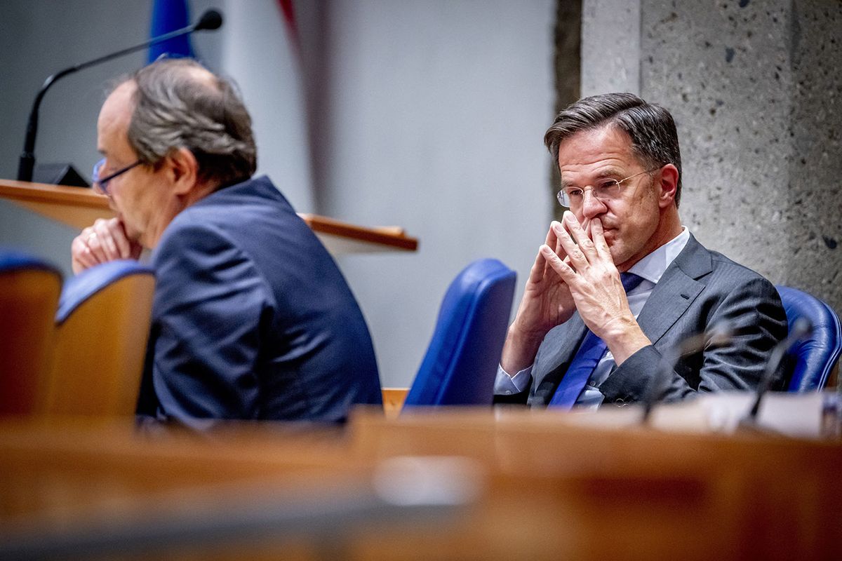 FILES-NETHERLANDS-POLITICS-GOVERNMENT(FILES) Dutch Prime Minister Mark Rutte (R) and State Secretary for Mining Hans Vijlbrief attend a debate on the report of the Parliamentary Inquiry Committee on Natural Gas Extraction in Groningen, at the House of Representatives in The Hague on June 7, 2023. Dutch Prime Minister Mark Rutte's coalition government collapsed after just a year and a half in office on July 7, 2023 in a row over measures to curb the flow of migrants, local media said. Rutte, the Netherlands' longest-serving leader, presided over crisis talks between the four coalition partners but failed to reach a deal, broadcasters NOS and RTL and the Dutch news agency ANP reported. (Photo by Robin UTRECHT / ANP / AFP) / Netherlands OUT
