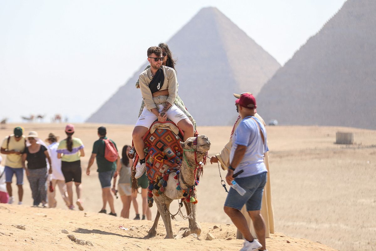Tourists flock to the Pyramids of Giza
GIZA, EGYPT - JUNE 29: Tourists flock to the Pyramids of Giza, namely Cheops, Khafre and Menkaure on the second day of Eid Al-Adha in Giza, Egypt on June 29, 2023. Mohamed El-Shahed / Anadolu Agency (Photo by MOHAMED EL-SHAHED / ANADOLU AGENCY / Anadolu Agency via AFP)