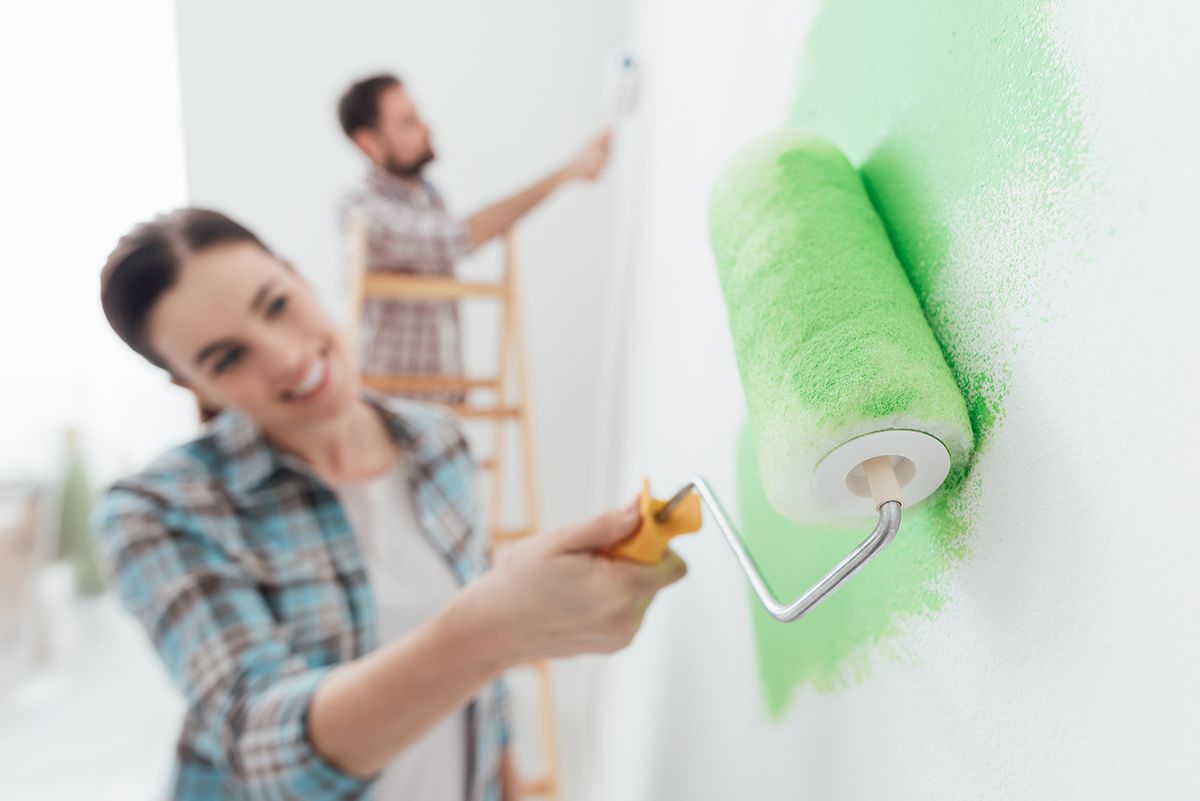 Happy,Couple,Painting,Walls,In,Their,New,House:,The,Man