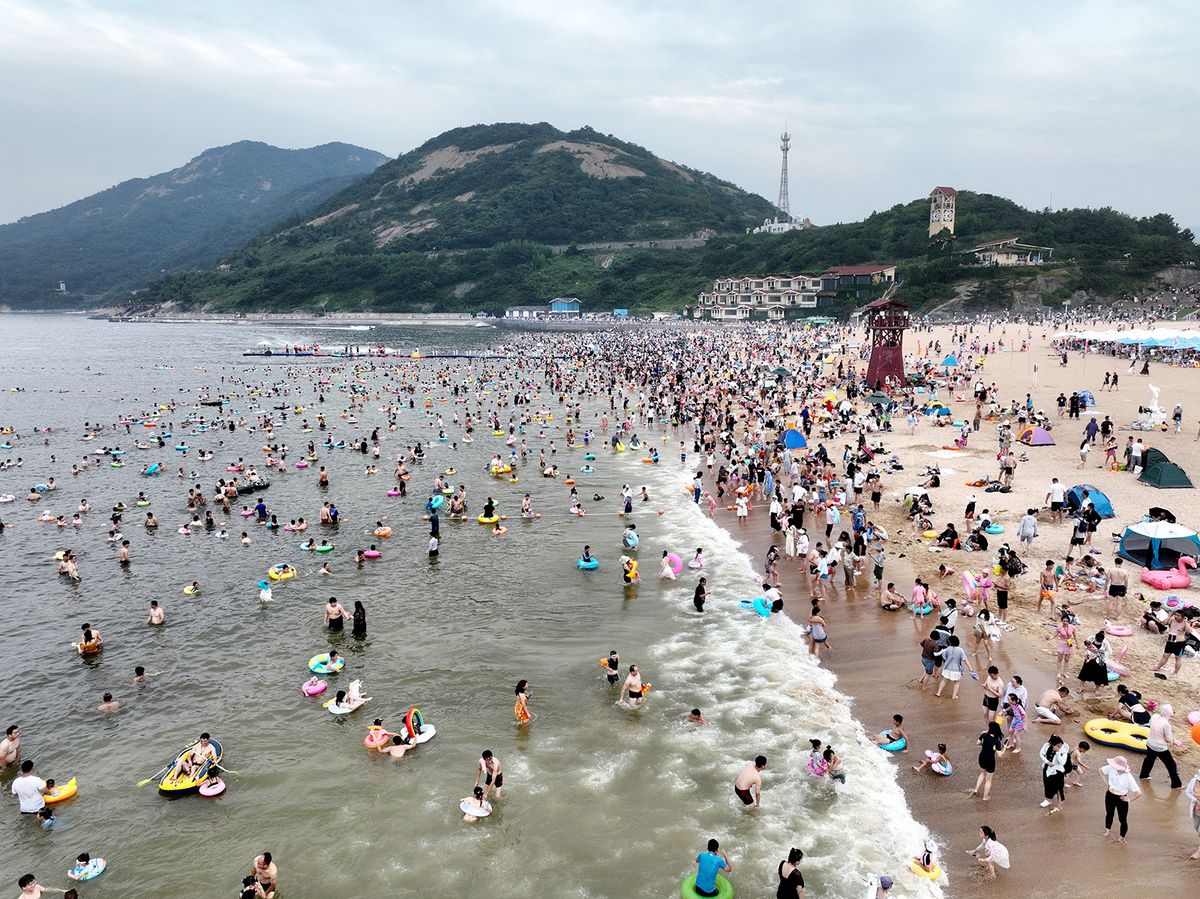 Tourists Cool Off in the Dasha Bay Beach in Lianyungang
LIANYUNGANG, CHINA - JULY 15, 2023 - Tourists cool off in the Dasha Bay Beach in Lianyungang City, East China's Jiangsu Province, July 15, 2023. (Photo by Costfoto/NurPhoto) (Photo by CFOTO / NurPhoto / NurPhoto via AFP)