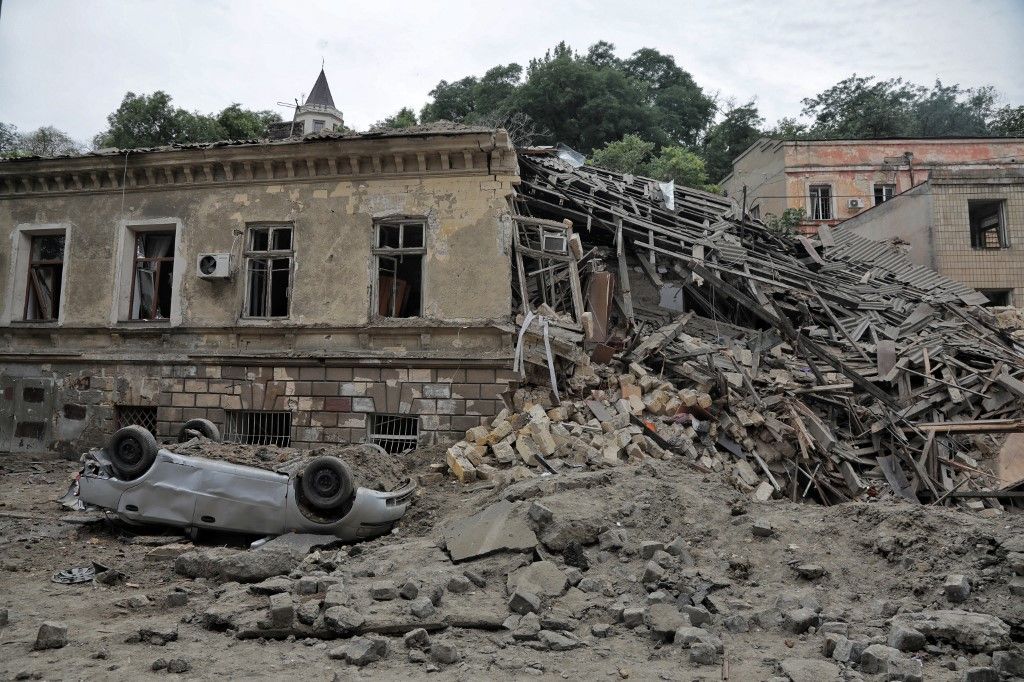 Russian Missile Attack On Odesa
ODESA, UKRAINE - JULY 23, 2023 - An overturned car is seen outside an old building in the historic centre of Odesa on the UNESCO World Heritage List damaged by the massive Russian missile attack that took place Sunday night, July 23, Odesa, southern Ukraine. During the large-scale overnight missile attack, Russian troops launched 19 missiles of various types at Odesa and the region. The strike killed one person and left 22 people injured, including four children. The historic centre of Odesa came under fire. Twenty-five architectural monuments were damaged, including Transfiguration Cathedral. NO USE RUSSIA. NO USE BELARUS. (Photo by Ukrinform/NurPhoto) (Photo by Nina Liashonok / NurPhoto / NurPhoto via AFP)